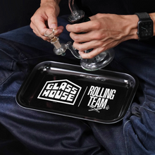  Person holding  black Glass House rolling Team tray 